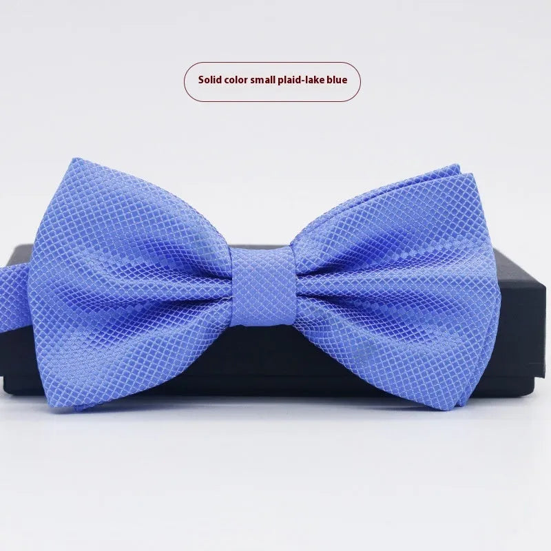 Men's flat head style polyester bow tie in a solid colour, shown with adjustable neck strap.