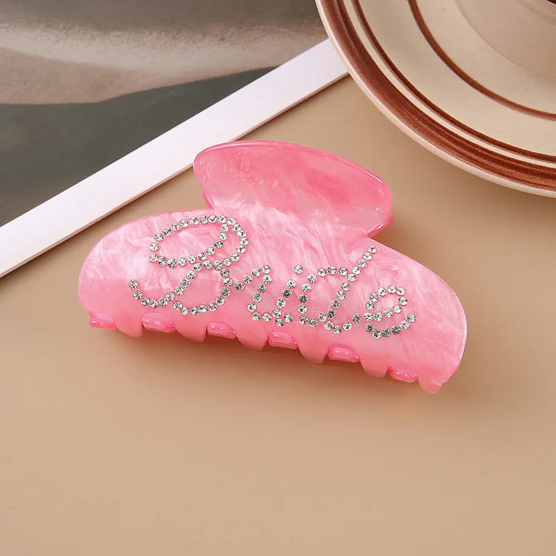 10cm long acrylic shower shark hair clip with diamond spot drill decoration in pink colour with back clip mechanism.
