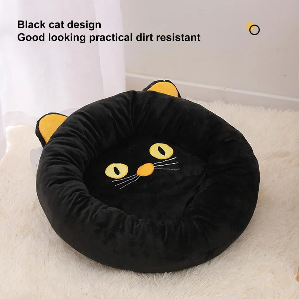Black cat shape velvet pet nest bed with raised edges, 50cm diameter, on floor