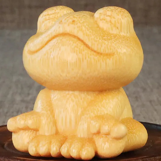 Smiling frog solid bamboo carving ornament measuring 5cm high with cartoon cute style