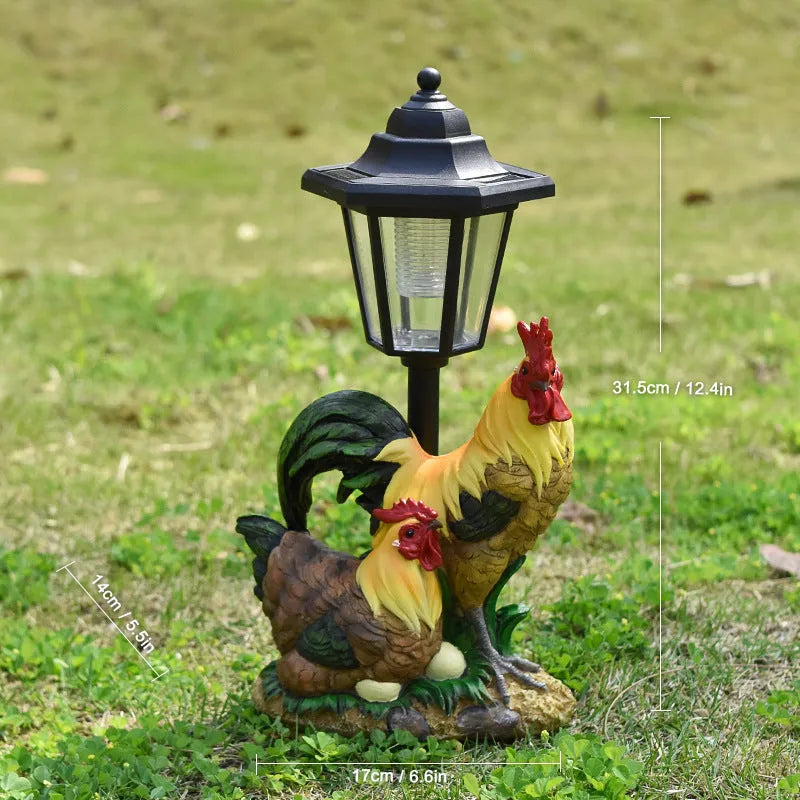 Solar hexagonal garden lamp with decorative resin figurine on plastic base for outdoor pathway lighting