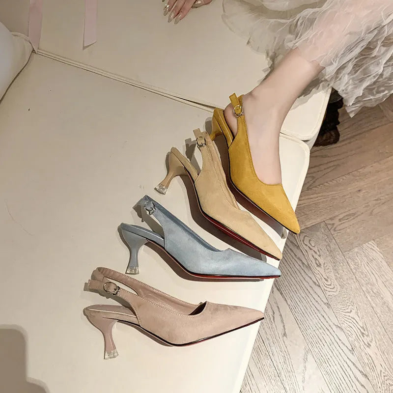 Apricot suede stiletto high heels with a pointed toe and rubber sole on a plain background.