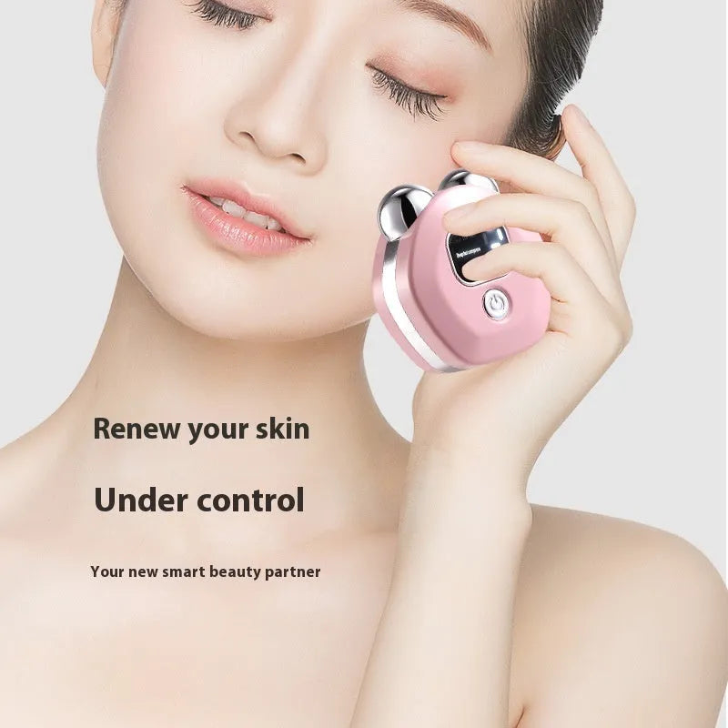 Portable white microcurrent facial massager with dual roller heads and hot compress function.