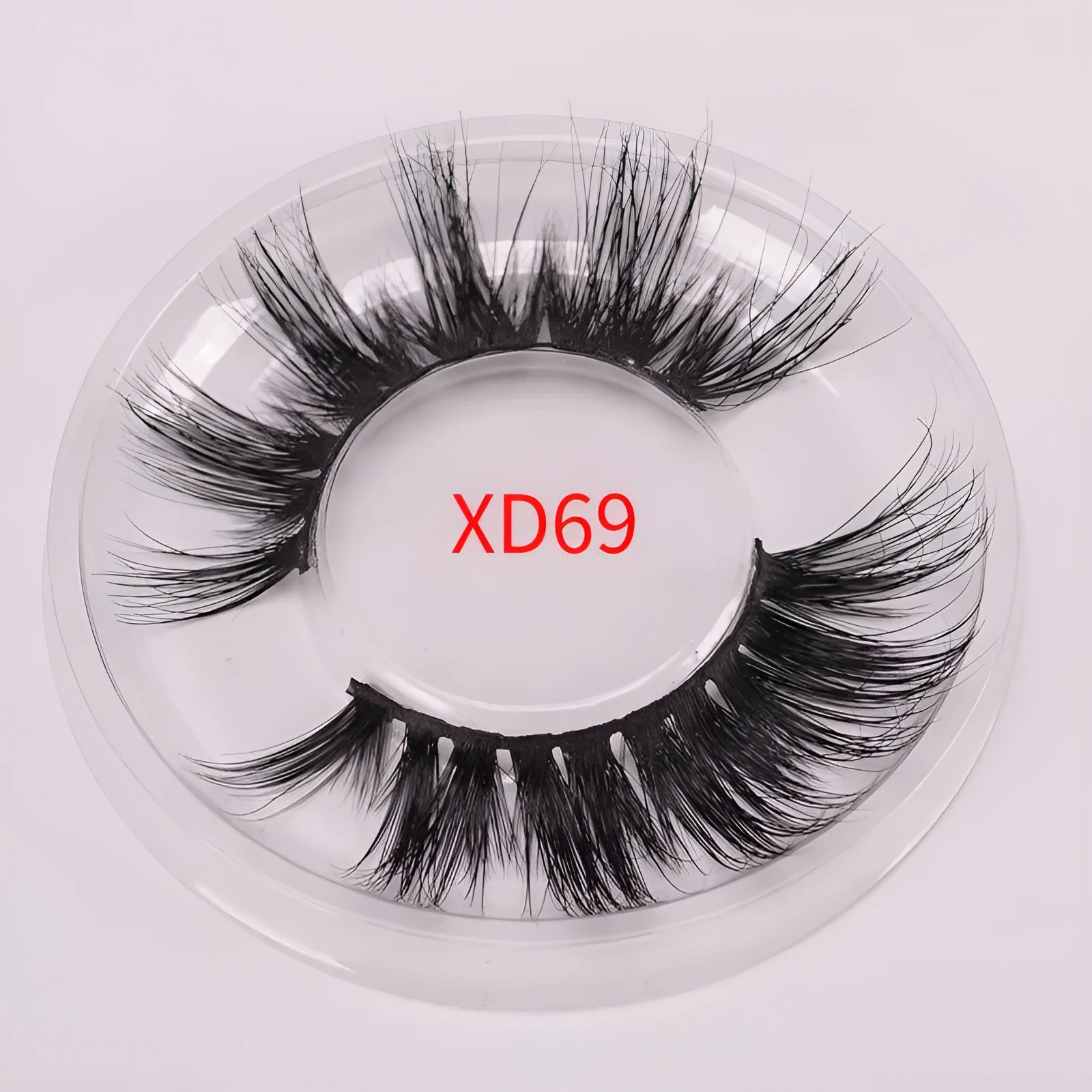 A pair of 5D volume false eyelashes made from real mink hair, with an application brush and storage case.