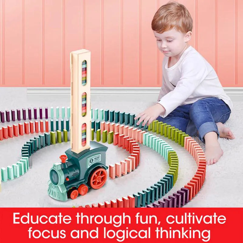 Domino train toy with 100 plastic dominoes in random colours, including toy train and card storage box