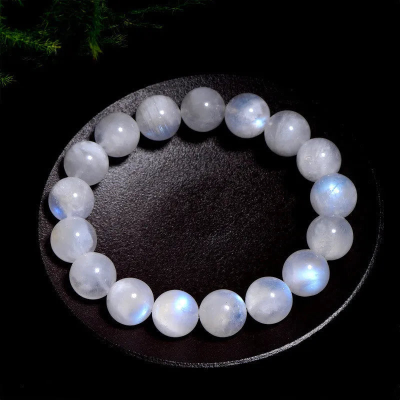 Natural blue moonstone bracelet with polished round beads showing sizing from 5mm to 12mm diameter