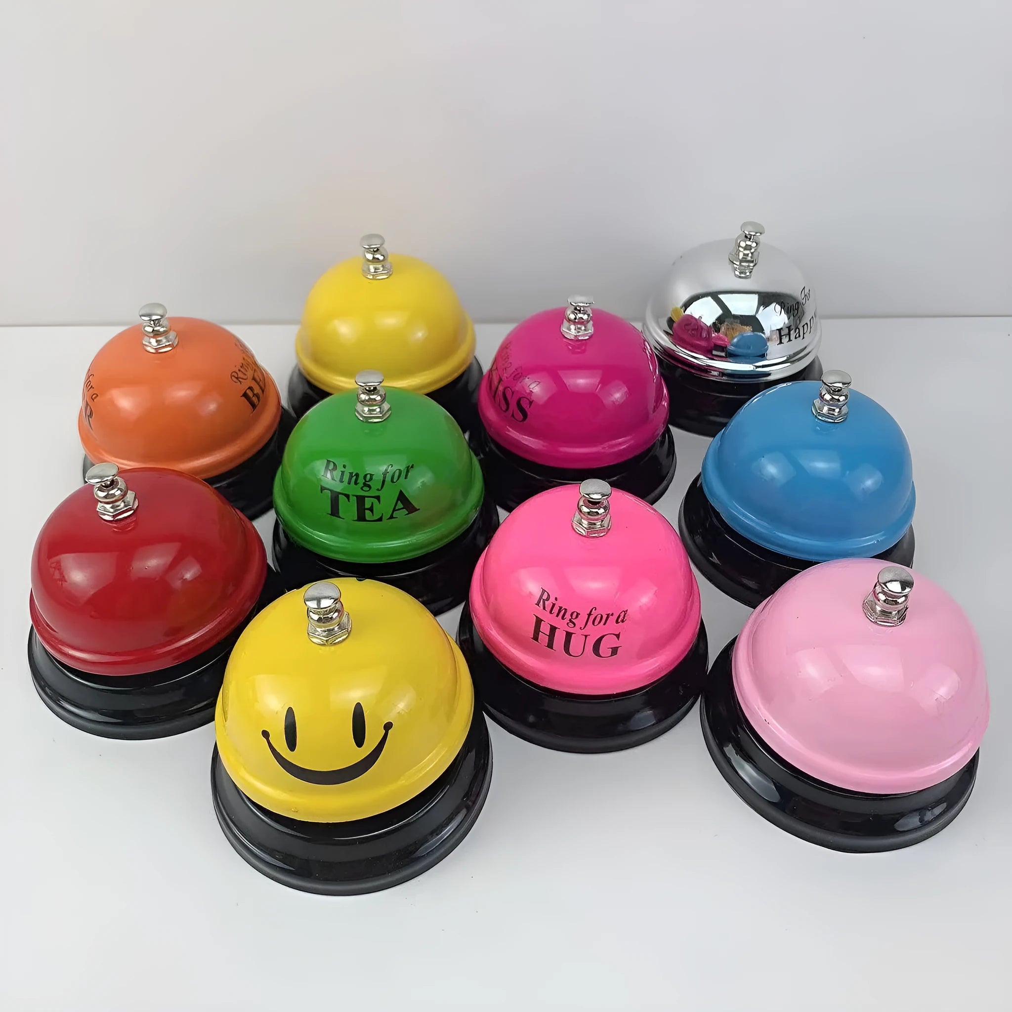 A multi-colour iron hand bell for games, classrooms, or restaurant service.
