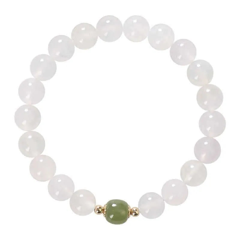 Handmade natural white agate crystal bracelet with cinnabar detail in 6mm or 8mm bead size.