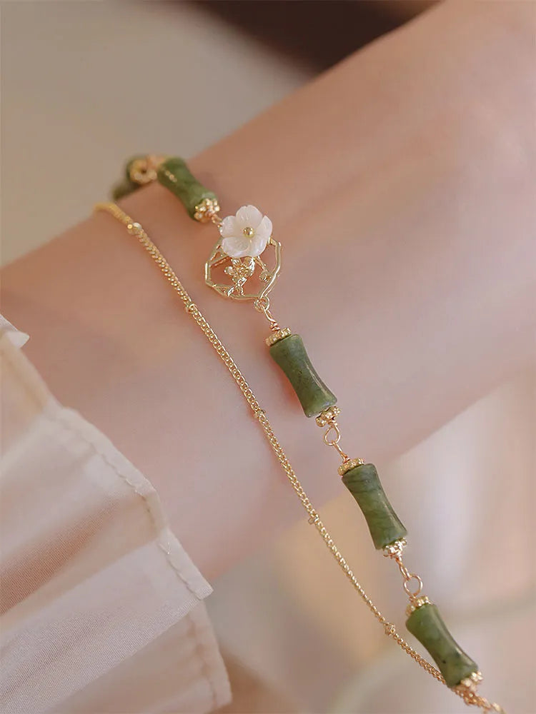 Natural olivine stone bracelet with Chinese double layer design and Bells of Ireland charms