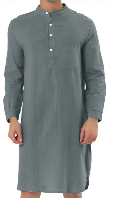 A man's long-sleeve cotton shirt robe in a light blue colour, showing a button front and chest pocket.