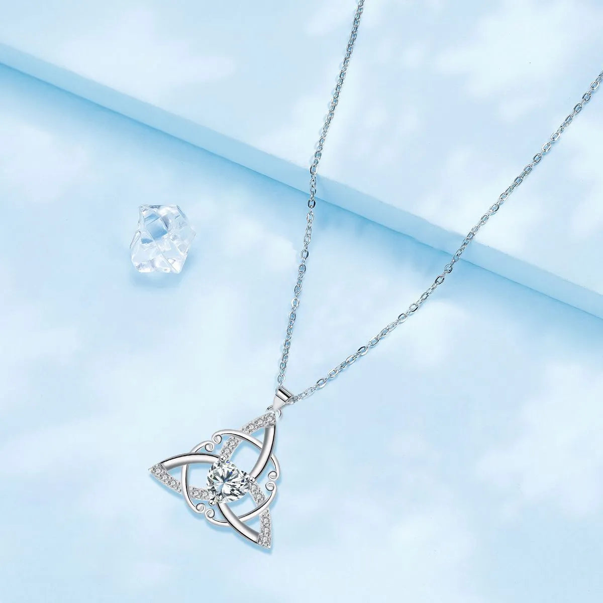 Women's Celtic knot necklace in copper with geometric pendant showing electroplated colour options