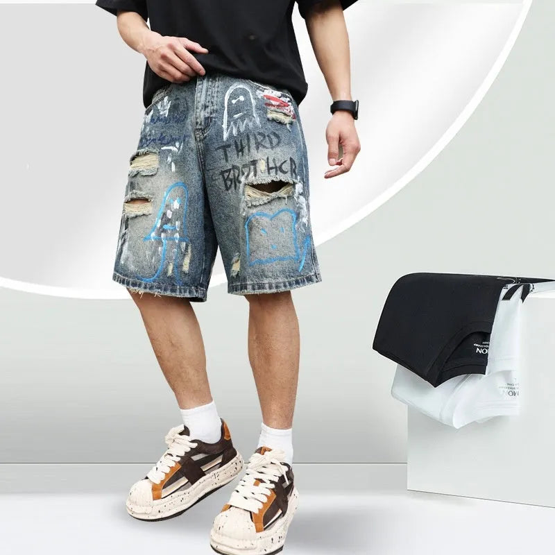 Men's blue ripped denim jeans shorts with graffiti print and straight leg design