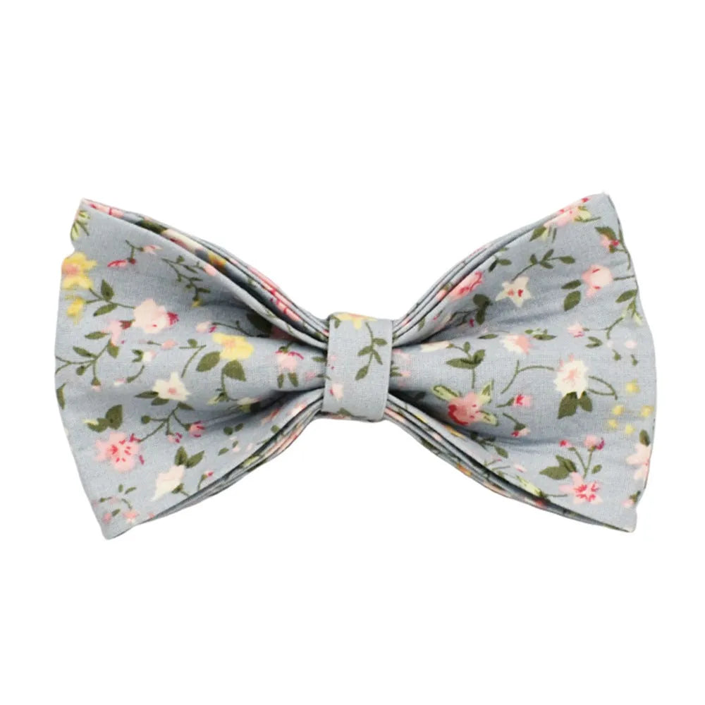 Blue floral pattern dog collar set with matching leash, bow, vest and waste bag dispenser accessories
