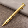Retro brass tactical pen with cylindrical barrel and six-ring grip, shown with press mechanism extended