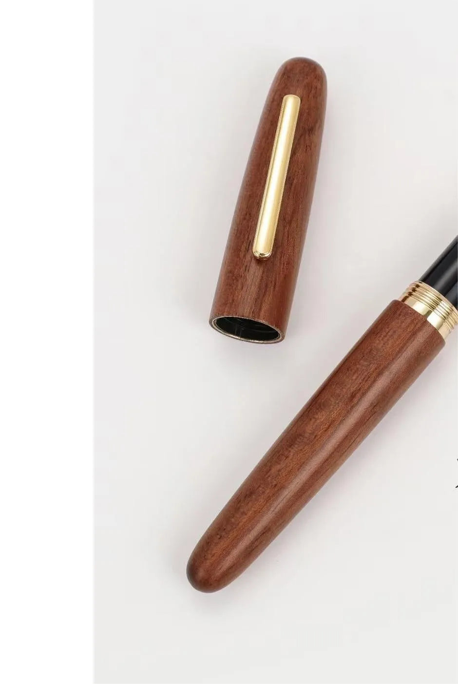 Wooden fountain pen with rotating cap showing choice of ebony, rosewood and tiger ebony finishes