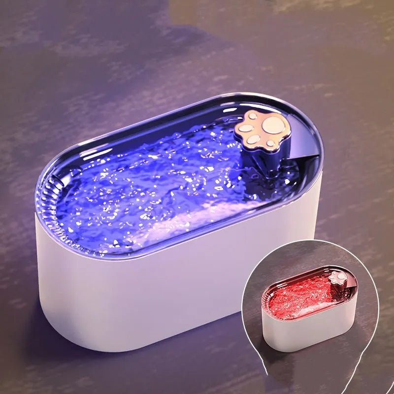 Berlin Blue 3-litre automatic pet water fountain with filter and LED light on a wooden floor.