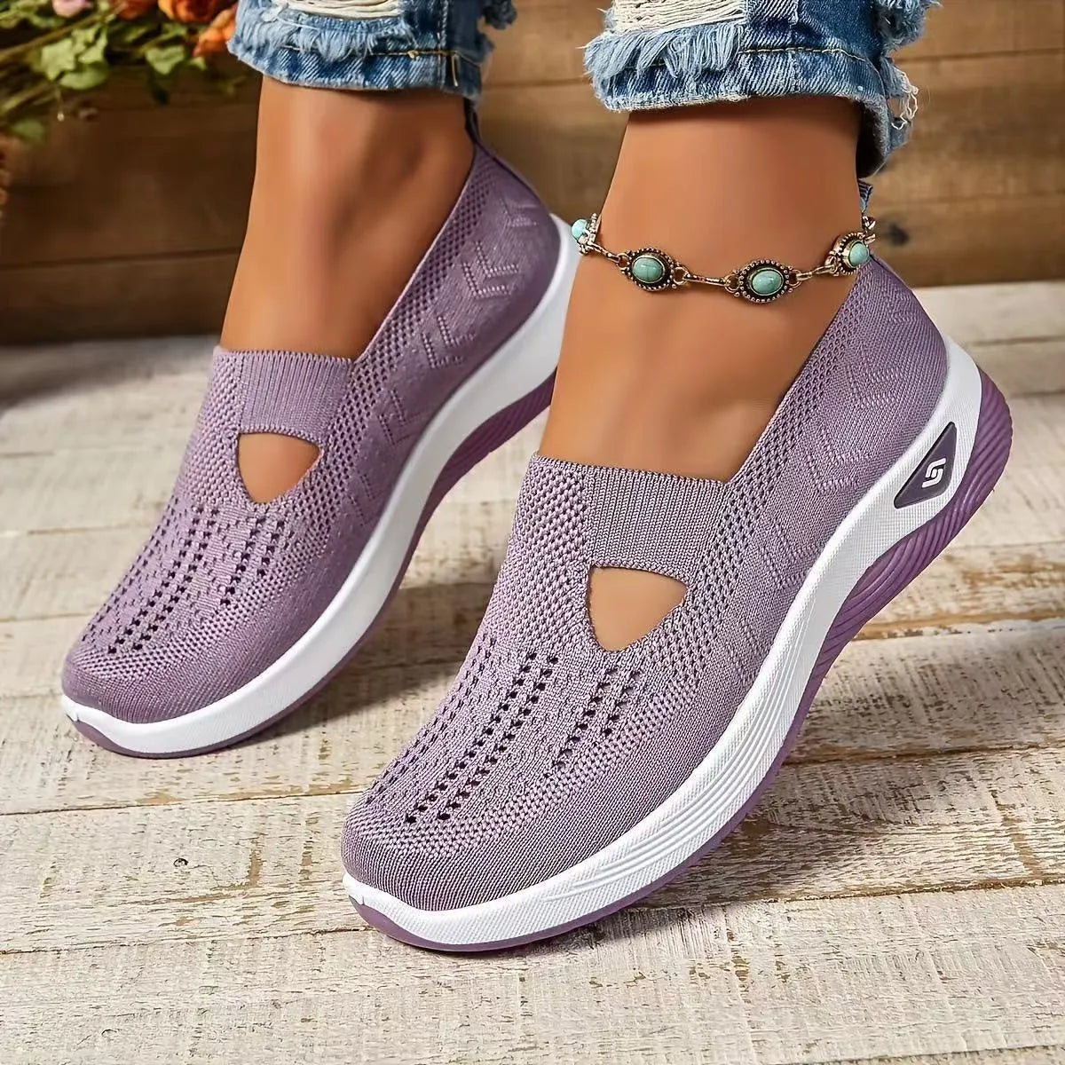 Women's black casual mesh shoes with T-strap and flat soft sole.