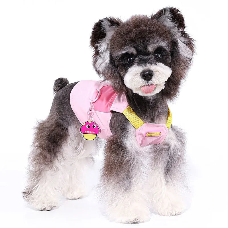 Pink adjustable traction vest on a small dog, showing the fit and fastening.