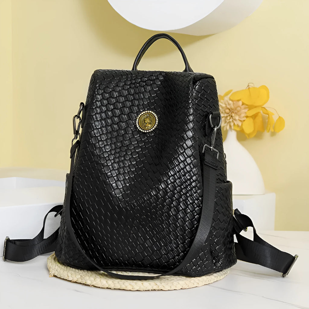 Women's black anti-theft backpack with multiple compartments and woven design details
