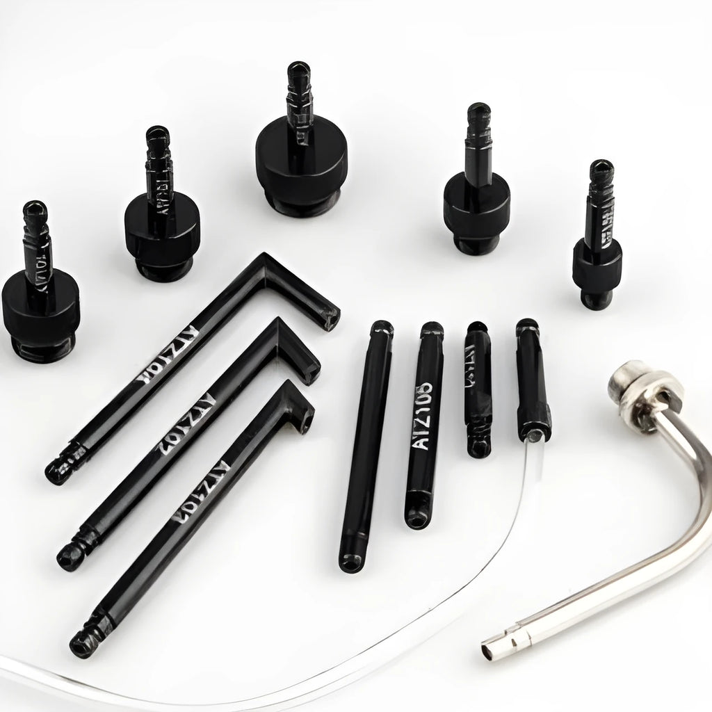 Automatic transmission oil refuelling tool kit with injector and connectors on a workshop bench