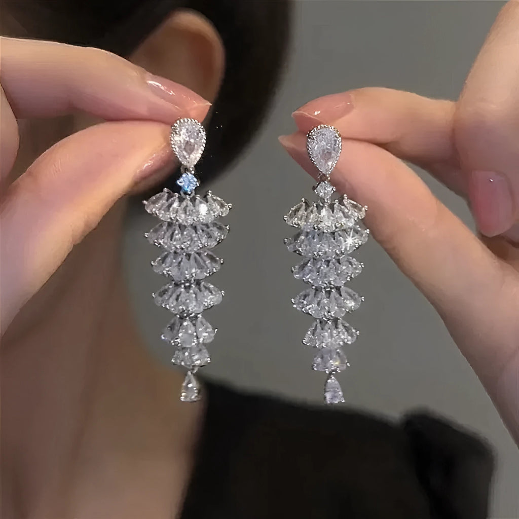 Christmas tree shaped drop earrings with sparkling zircon stones in silver pagoda colour