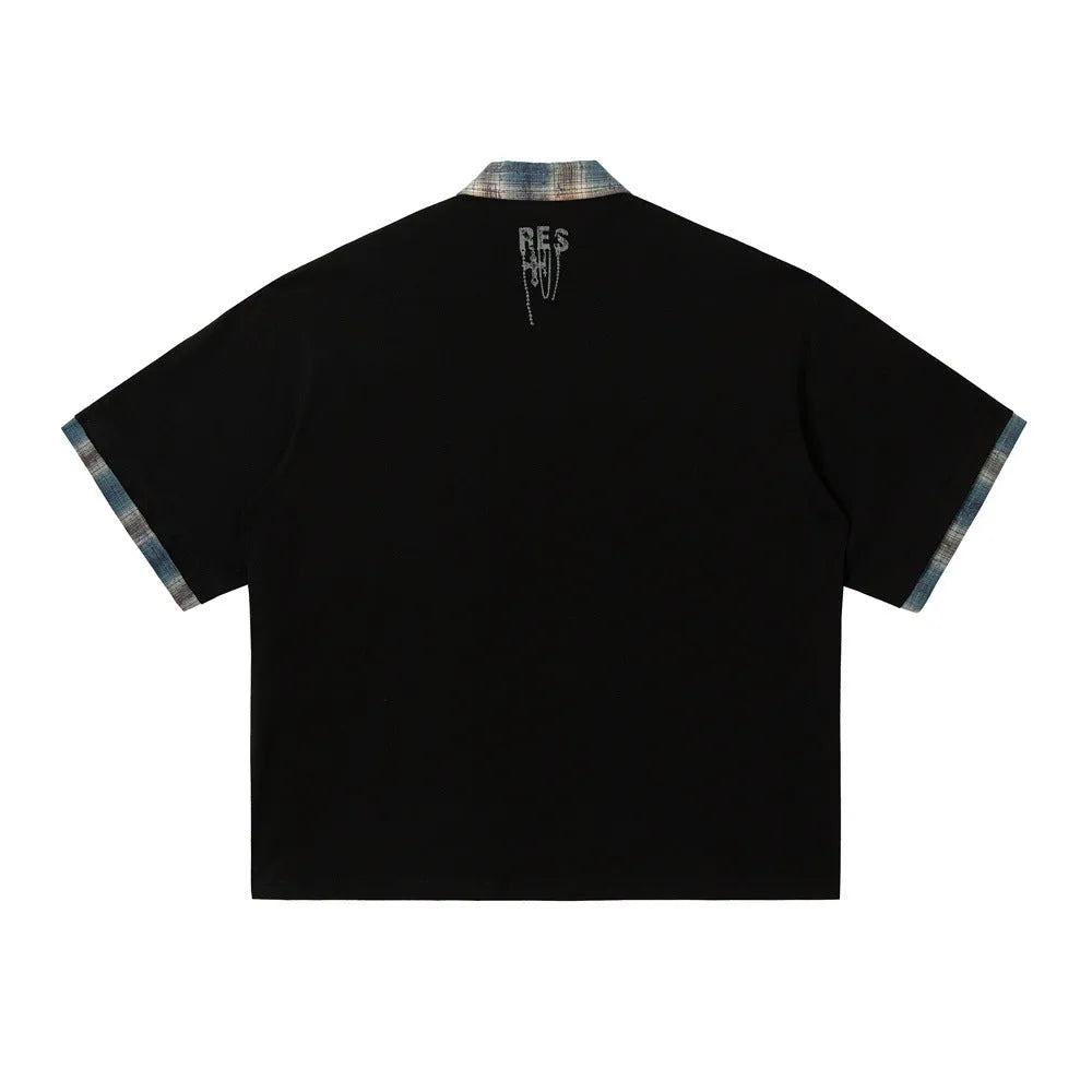 Men's loose blue cotton top with a short sleeve and an asymmetric lapel featuring a graffiti print.