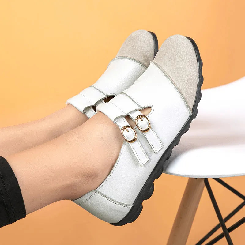 Women's casual flat shoes with Velcro fastening in black, showing round toe and beef tendon sole