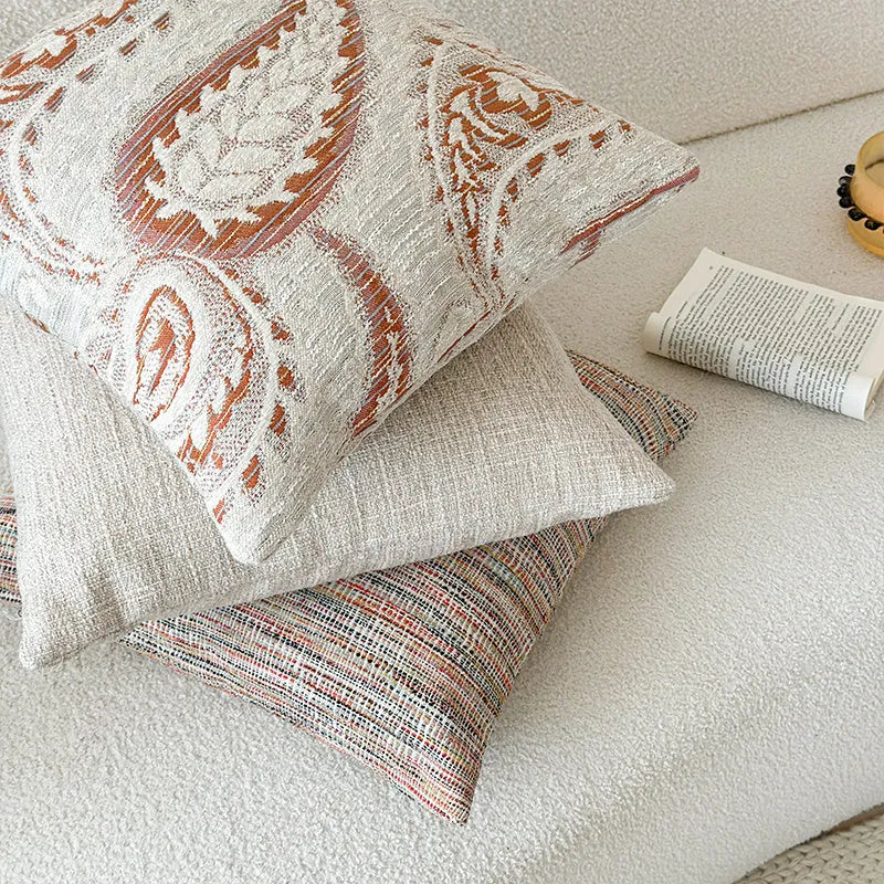 Amber jacquard paisley patterned sofa cushion cover with botanical floral design.
