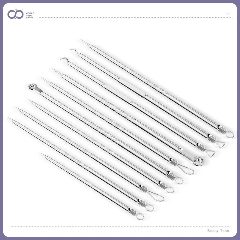 Four ultra-fine pointed metal acne needles for professional skin extraction, laid out on a surface.