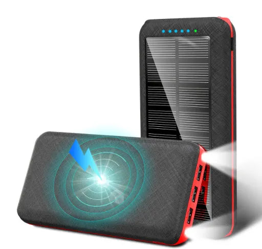 Portable power bank with wireless charging pad and three USB ports in black plastic casing