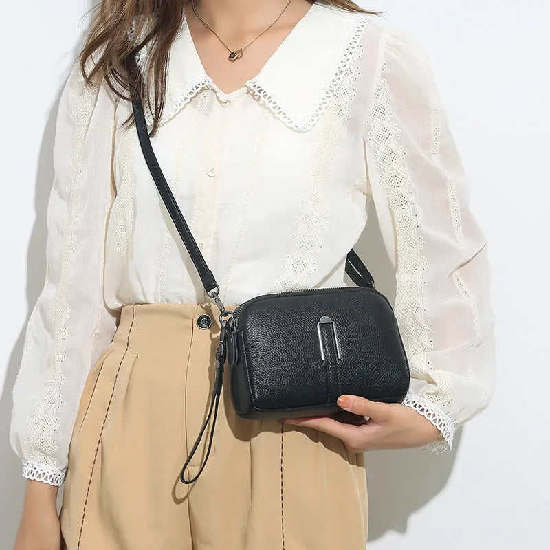 Genuine leather women's square shoulder bag in dark green, showing its horizontal 19x13x6cm shape.