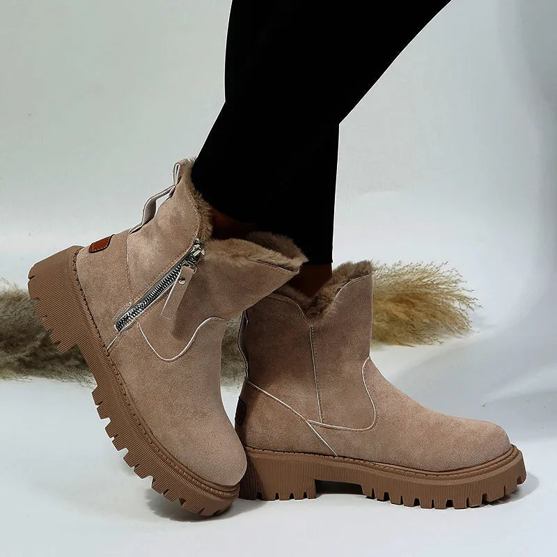 Women's black high-top snow boots with a side zipper and faux suede upper on a rubber sole.