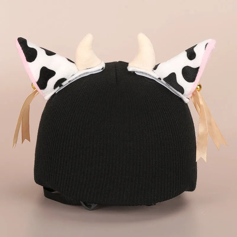 Cute plush cartoon animal character hat designed to decorate a standard ski helmet.