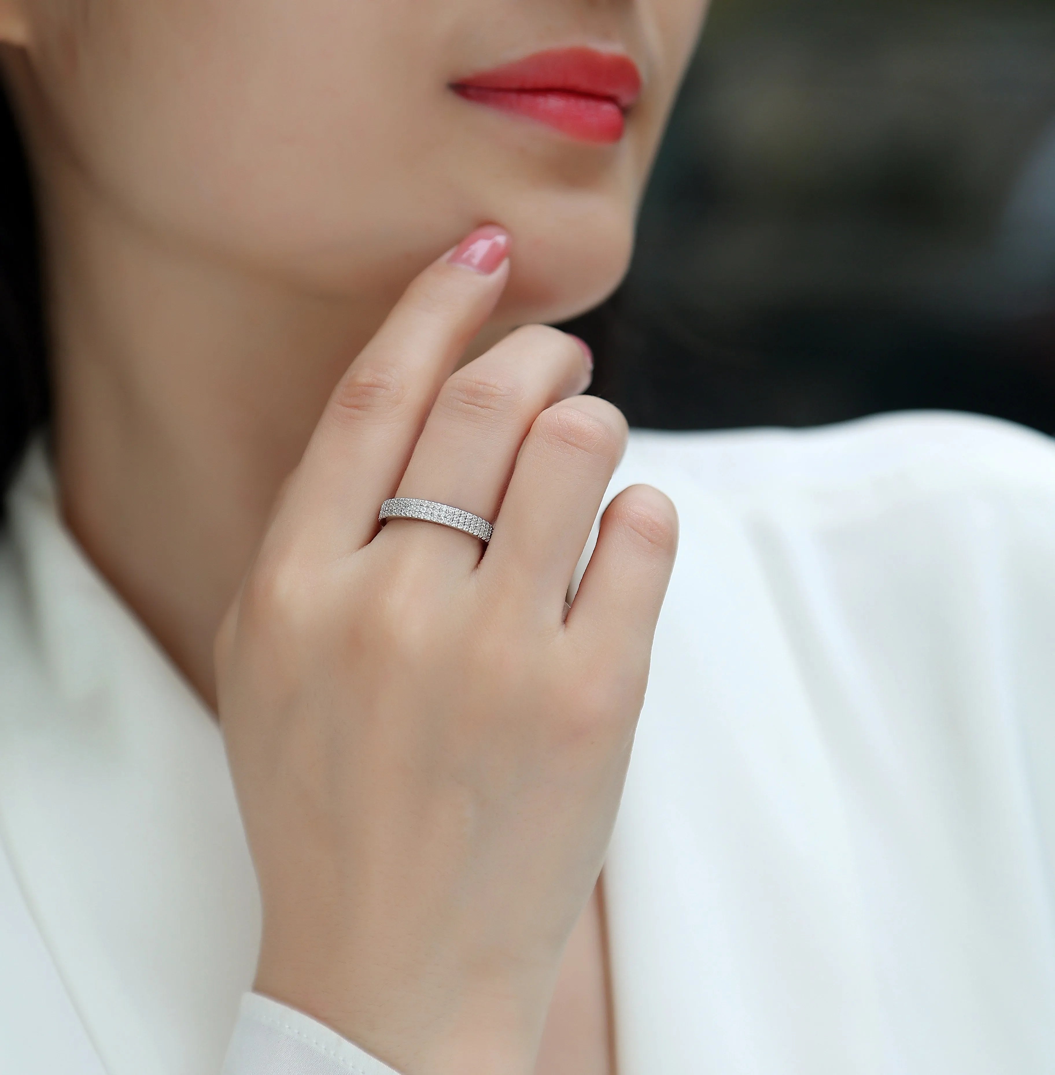 Moissanite wedding ring set in S925 silver with platinum plating, yellow gold colour, on white background