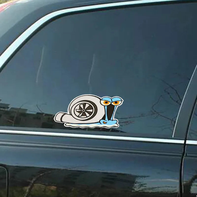White reflective car sticker with a printed cartoon snail design, shown at 12cm by 8cm scale
