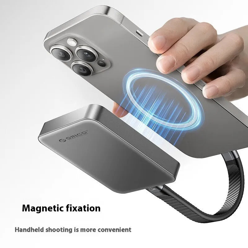 Grey magnetic mobile solid-state drive with suction ring, shown next to a USB-C cable.
