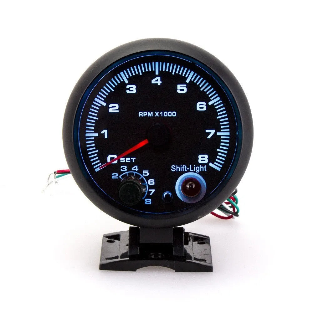 Black automotive tachometer with blue light pointer for engine speed measurement