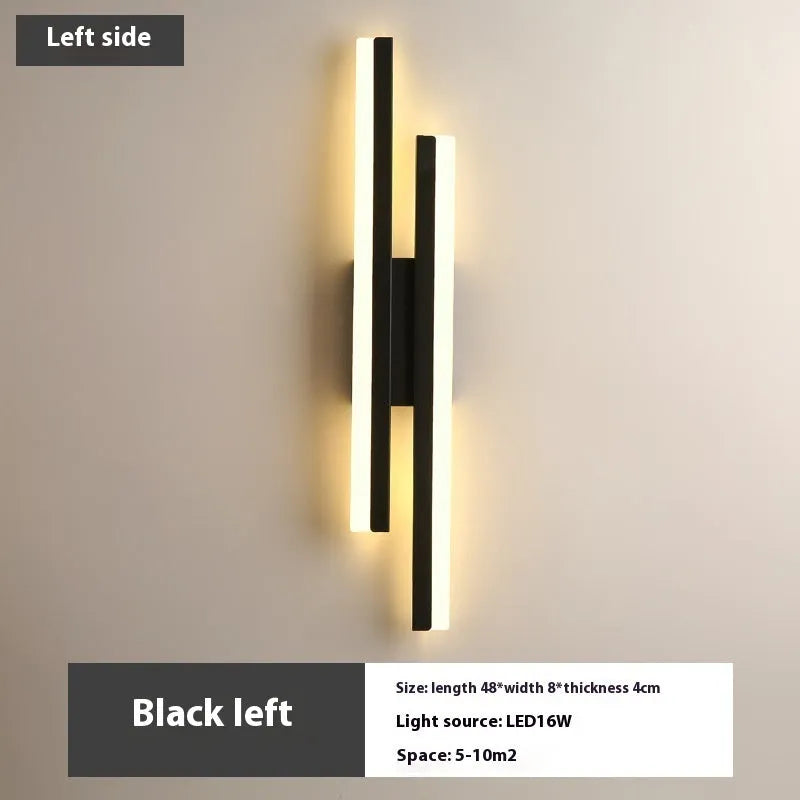 Modern Scandinavian minimalist LED wall light with acrylic shade in black or gold finish.