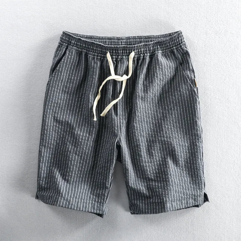 Men's striped cotton casual shorts in a loose straight fit on a mid-waist, shown in light blue colour.