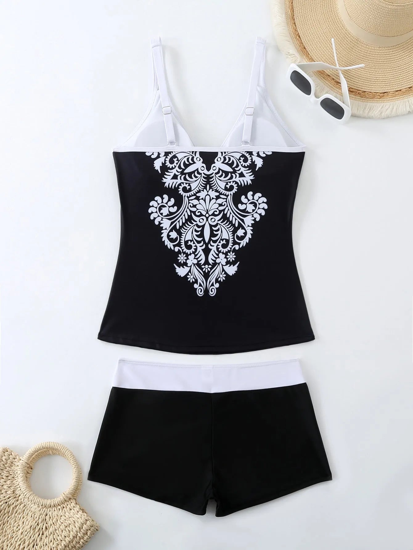 Plus size black and rose red split swimsuit set with matching trunks.