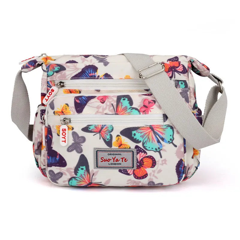 Lightweight printed nylon shoulder bag with double straps and floral or butterfly design