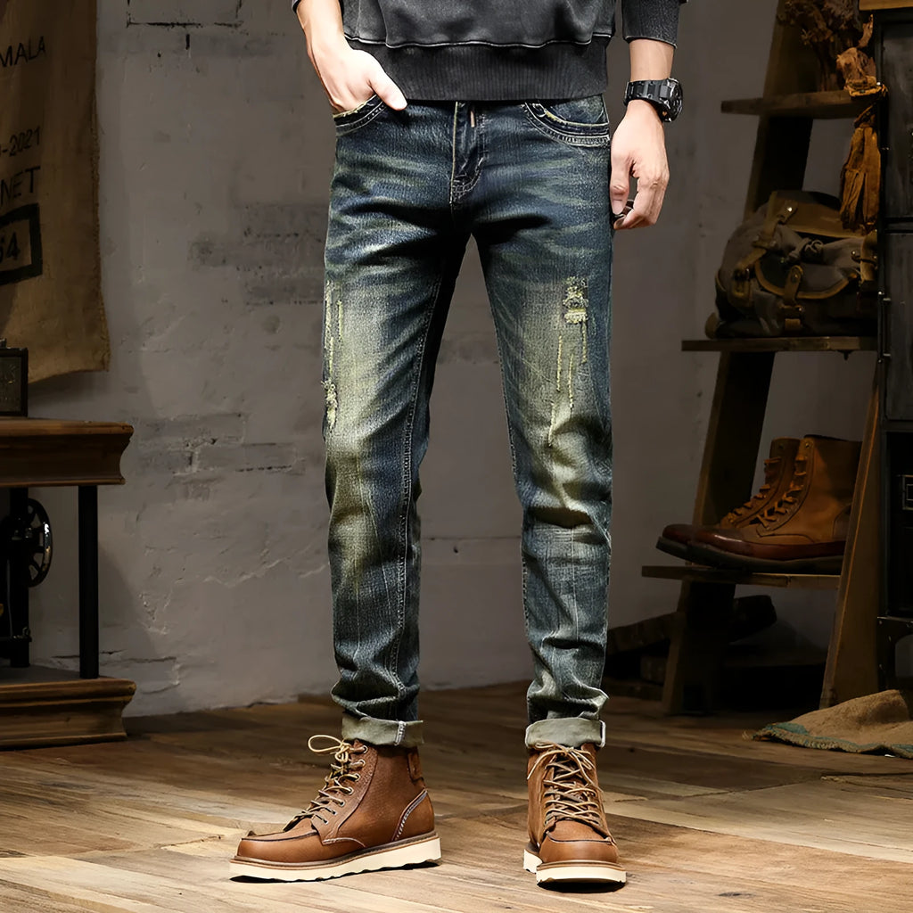 Men's skinny fit retro colour jeans with a zip fly, laid flat.