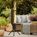 Vertical cast iron rocket furnace wood burning stove for courtyard heating.