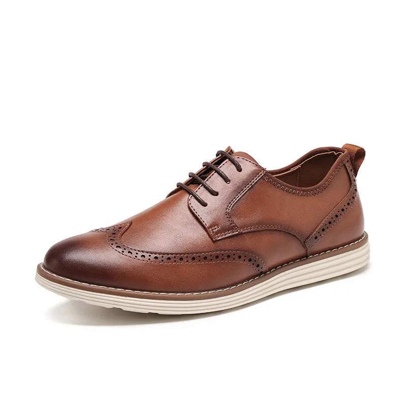 Men's black slip-on business casual shoes with round toe and carved sole detail on a white background.