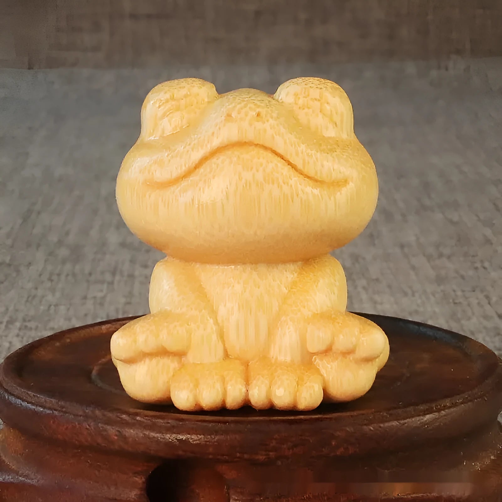 Smiling frog solid bamboo carving ornament measuring 5cm high with cartoon cute style