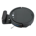 Black automatic recharge vacuum cleaner with remote control on a hard floor, showing its charging base