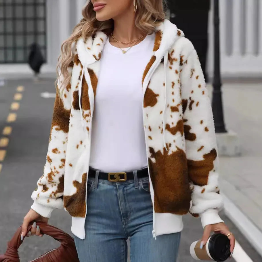 Yellow brown cow print hooded zip-up cardigan jacket on a hanger