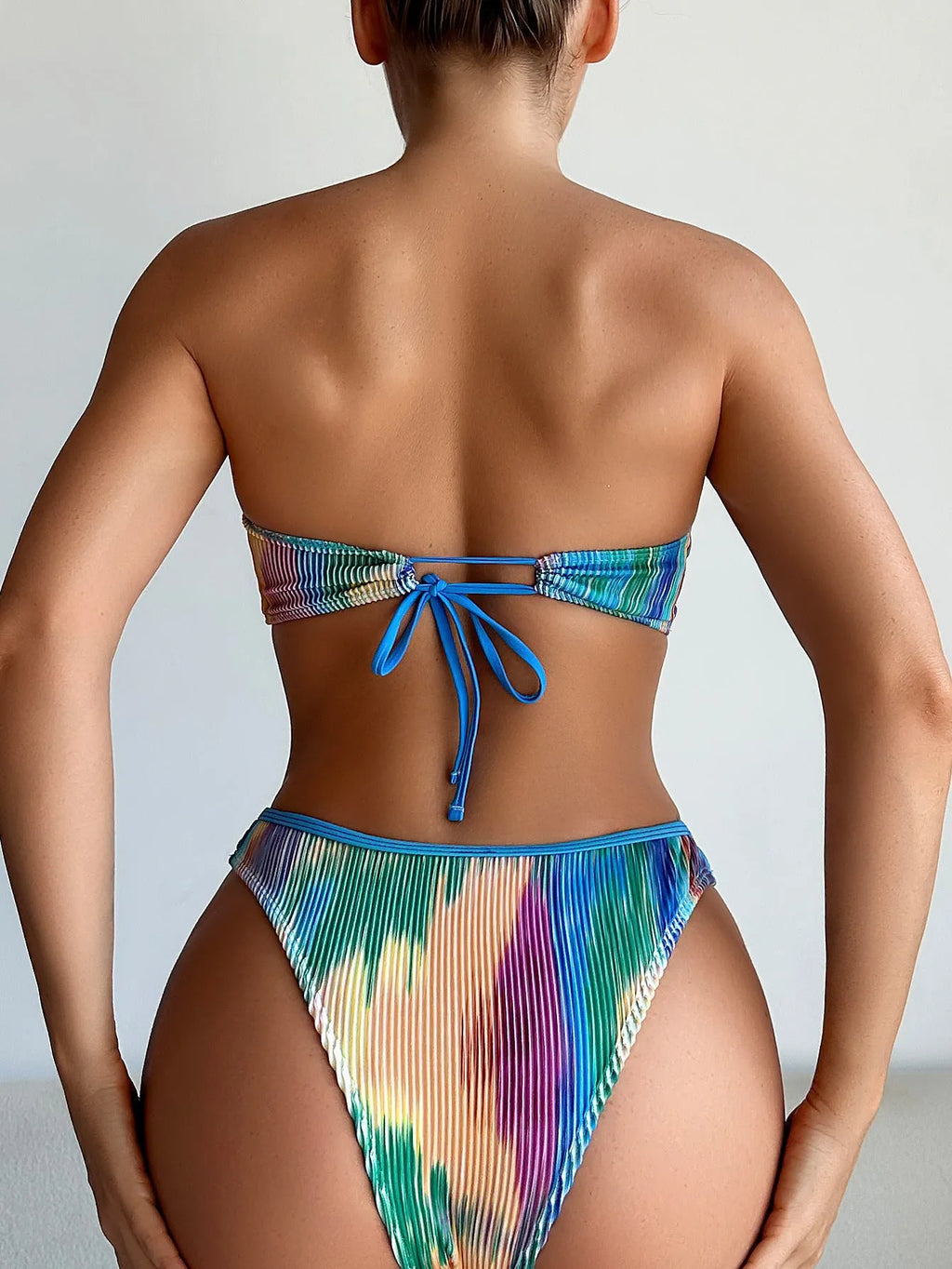 Colour printed tube top bikini set with matching briefs on a model.