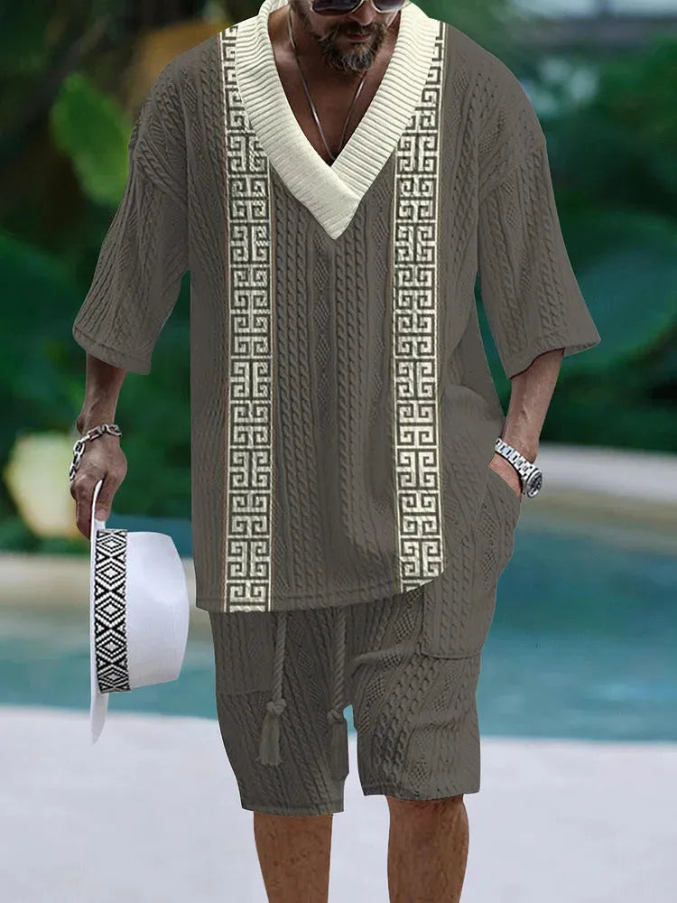 Man wearing a loose fit casual short sleeve top and matching shorts suit set