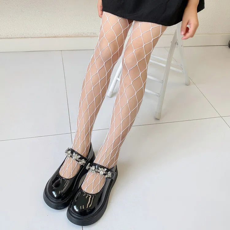 Women's mesh stockings showing large, medium and small patterns in black and white colours